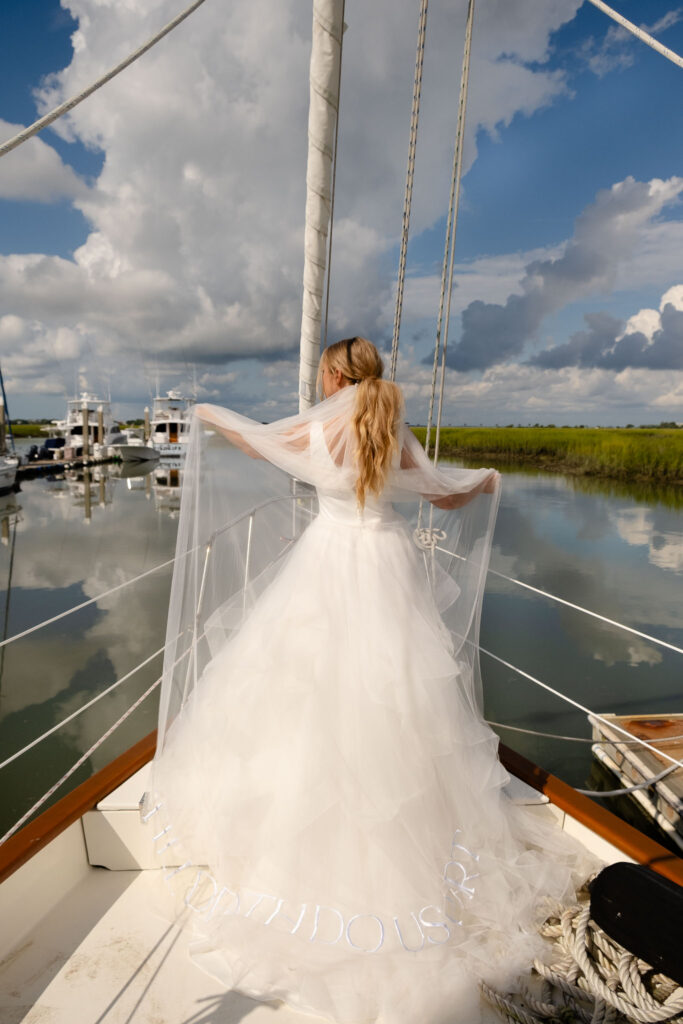 Bridal Editorial Inspo, black and white, model on sailboat, bridal portrait