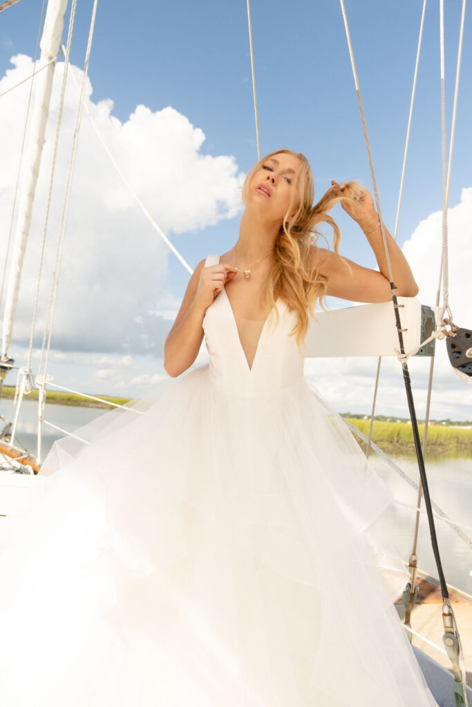 Bridal Editorial Inspo, black and white, model on sailboat, bridal portrait