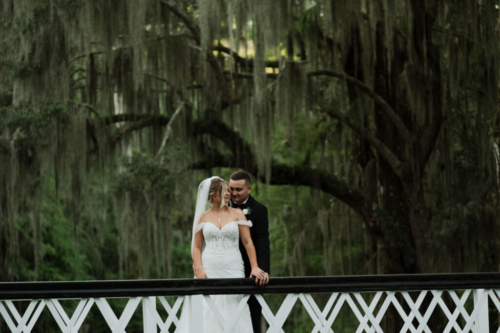magnolia plantation wedding couple standing on bridge charleston documentary wedding photographer