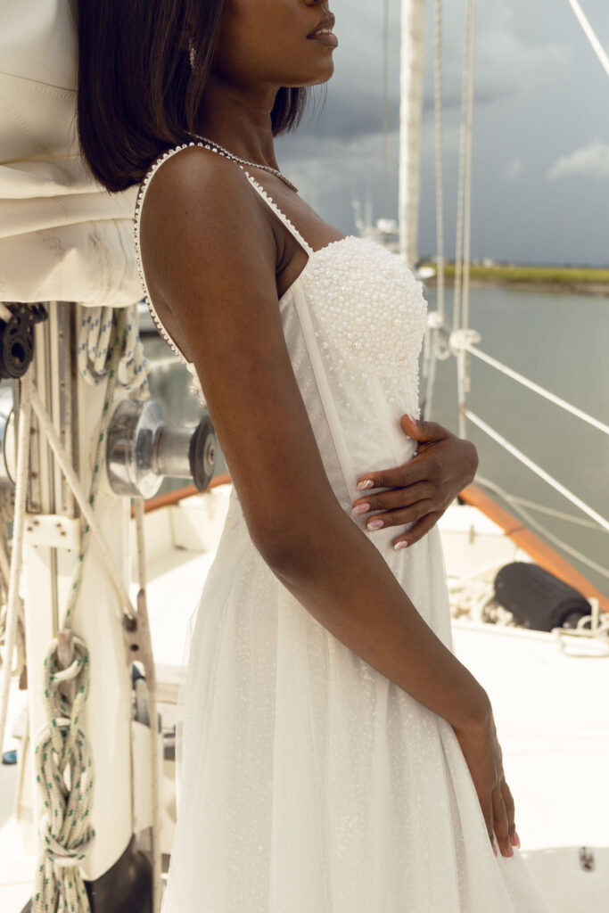 bridal gown, michael addison bridal, taylor l czerwinski photography, bride on sailboat in wedding dress, pearl wedding dress, styled bridal shoot