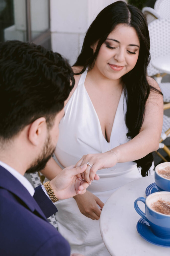 coffee shop engagement photos with mugs and coffee, girl in white dress in charleston sc