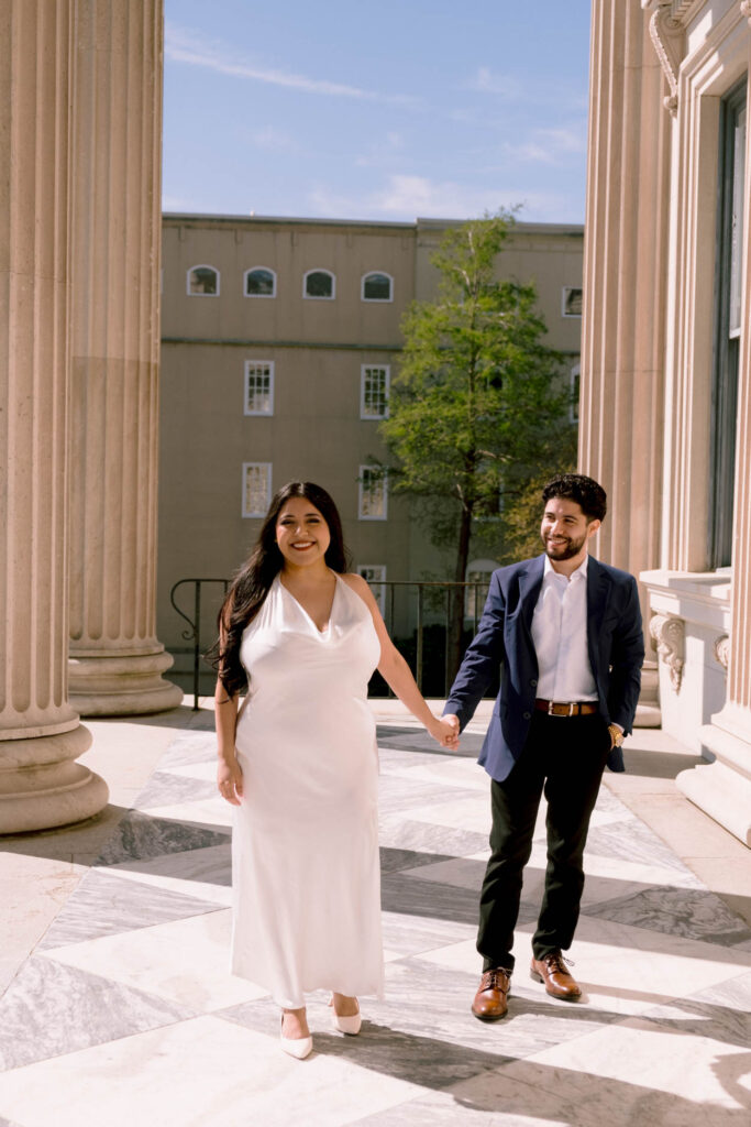 customs house engagement photos of man and woman in white dress and tux 
charleston wedding and engagement photographer near me
