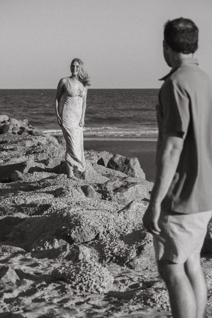 black and white photo of couple on beach documentary wedding style