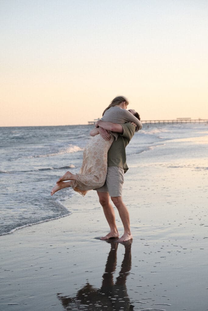 couple walking on beach documentary style photography wedding and engagement