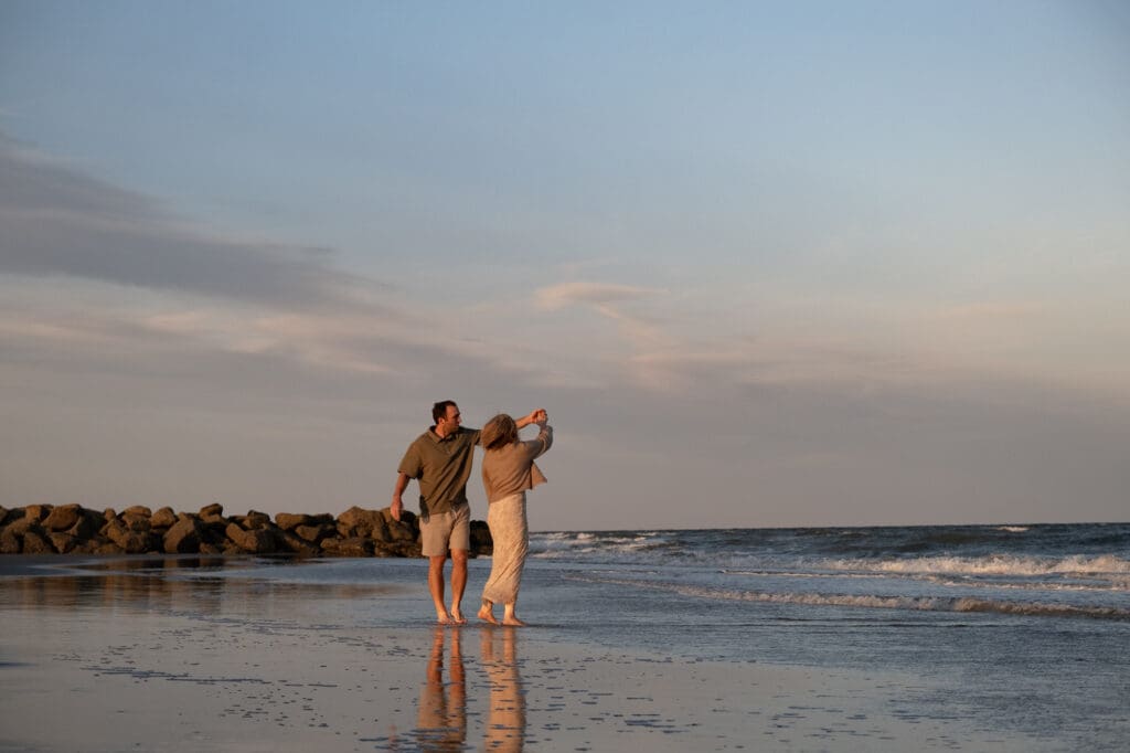 couple walking on beach documentary style photography wedding and engagement