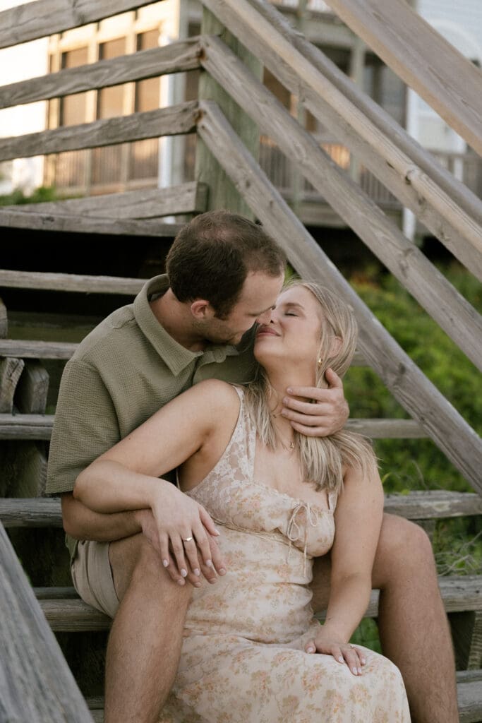 couple kissing on beach documentary style photography wedding and engagement