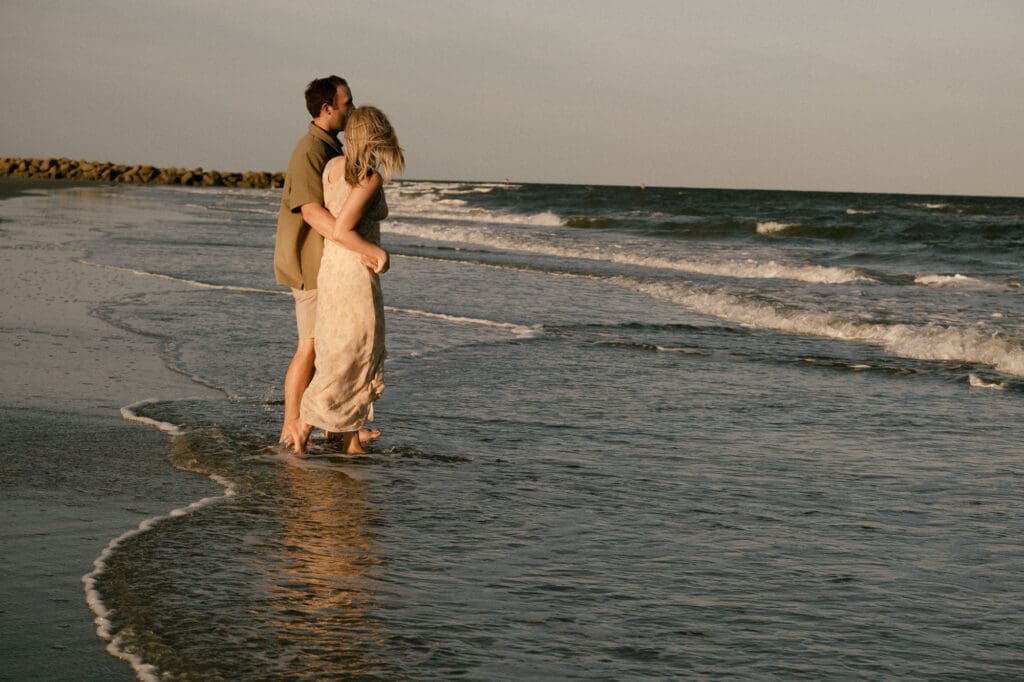 couple walking on beach documentary style photography wedding and engagement