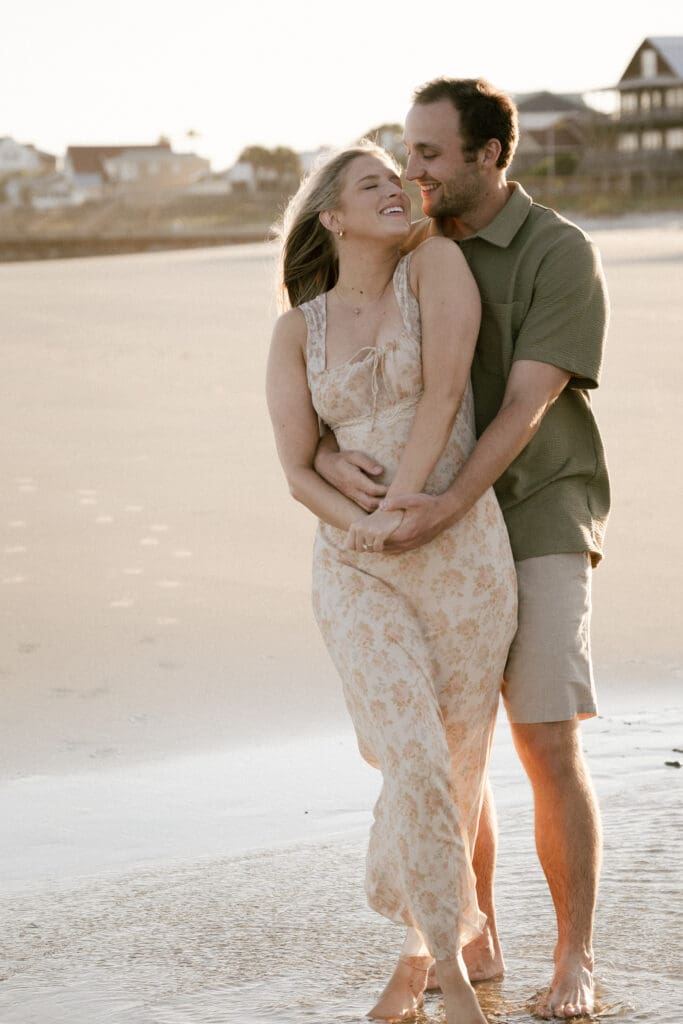 couple walking on beach documentary style photography wedding and engagement