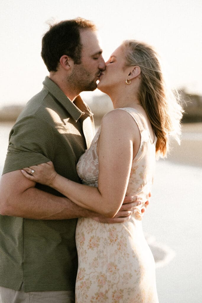 couple kissing on beach documentary style photography wedding and engagement