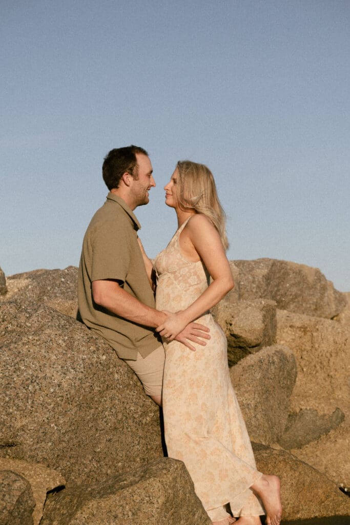 couple walking on beach documentary style photography wedding and engagement