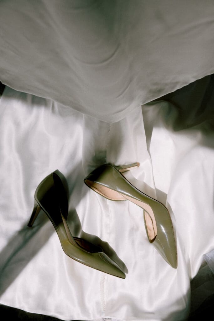 bride shoes with wedding dress moody and documentary luxury style