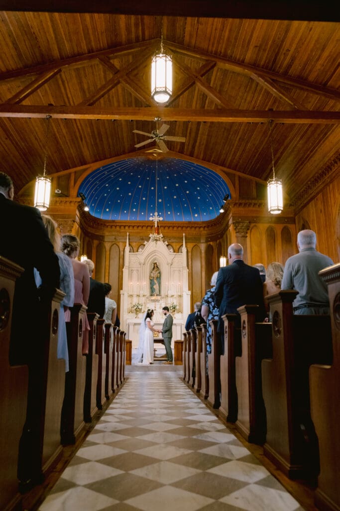 bride and groom at the alter in church