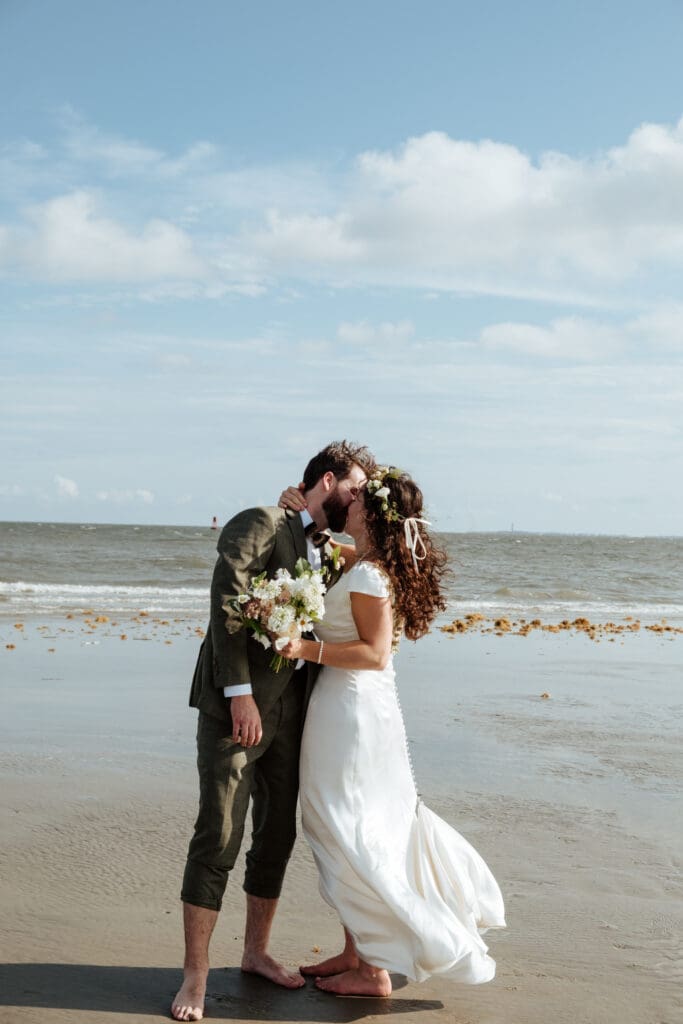 bride and groom kissing wedding photo on beach charleston sc