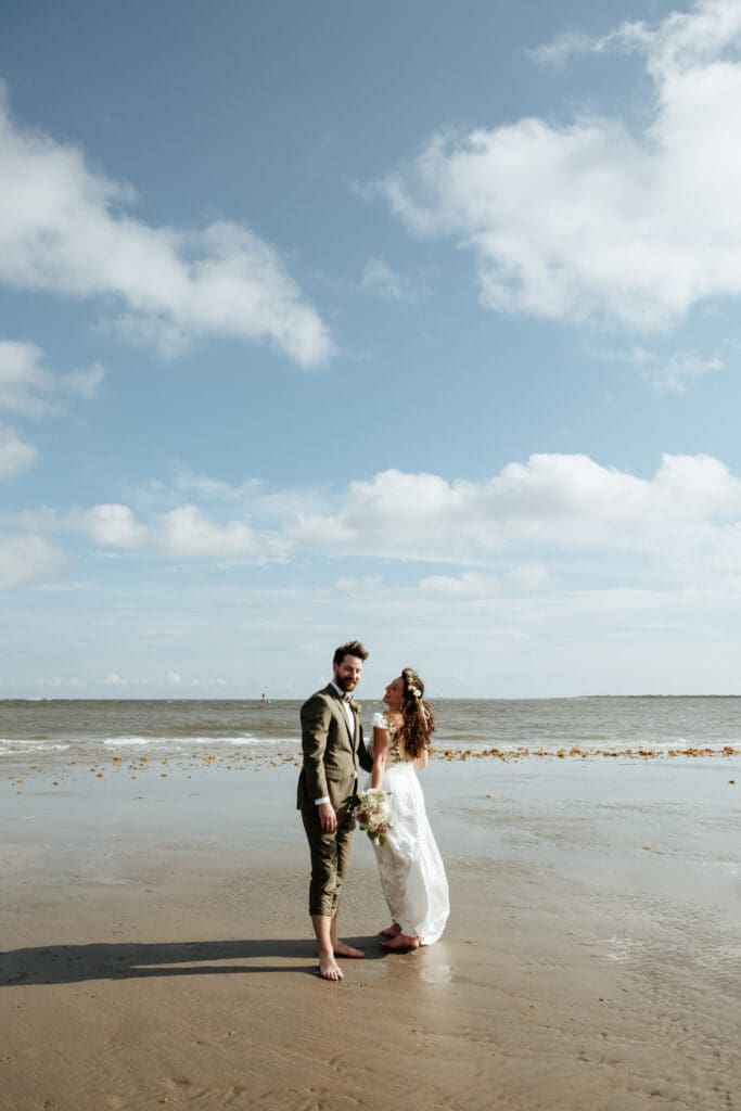 bride and groom kissing wedding photo on beach charleston sc