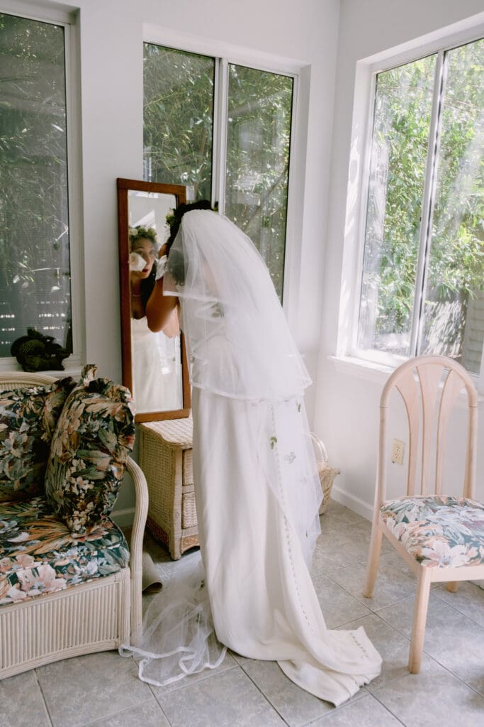 bride getting ready in wedding gown on wedding day documentary wedding photography