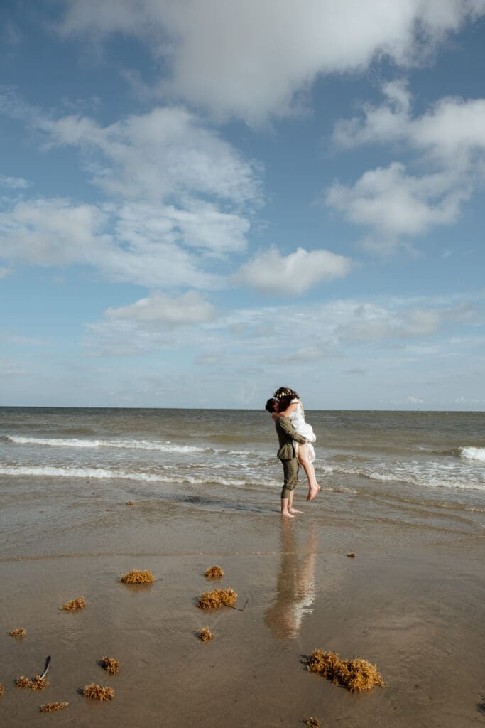 bride and groom kissing wedding photo on beach charleston sc