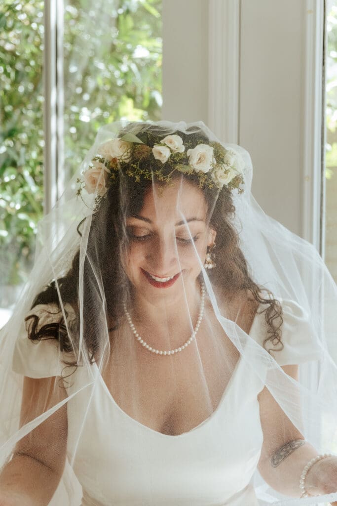 bride getting ready in wedding gown on wedding day documentary wedding photography