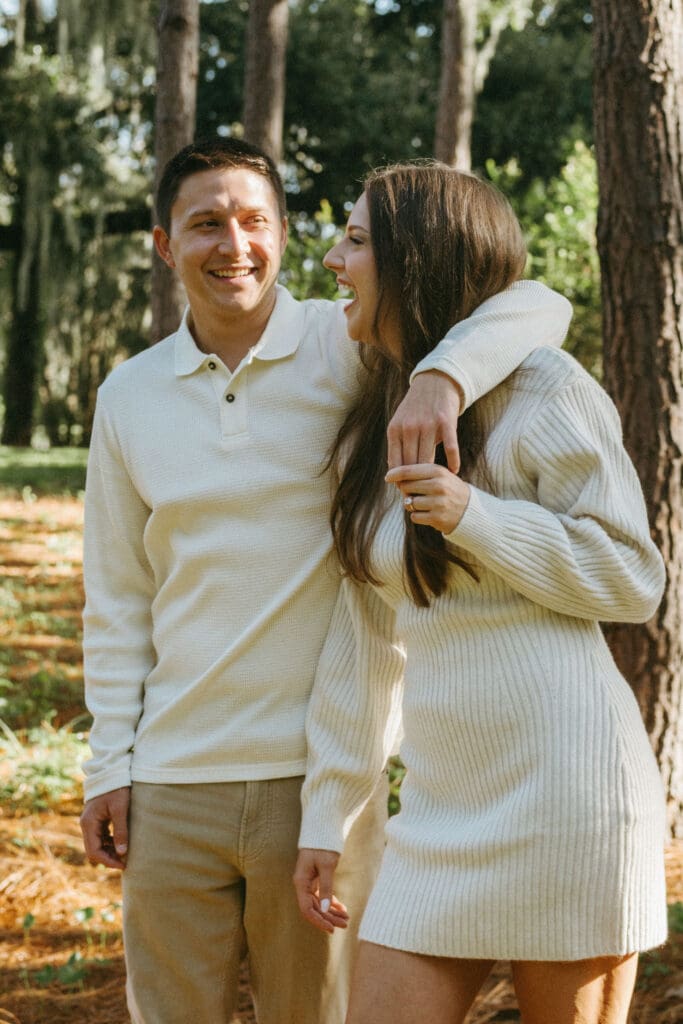 engagement shoot documentary style candid of couple outside under tree hampton park engagement photoshoot