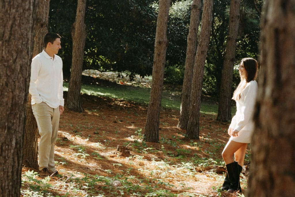 engagement shoot documentary style candid of couple outside under tree hampton park engagement photoshoot