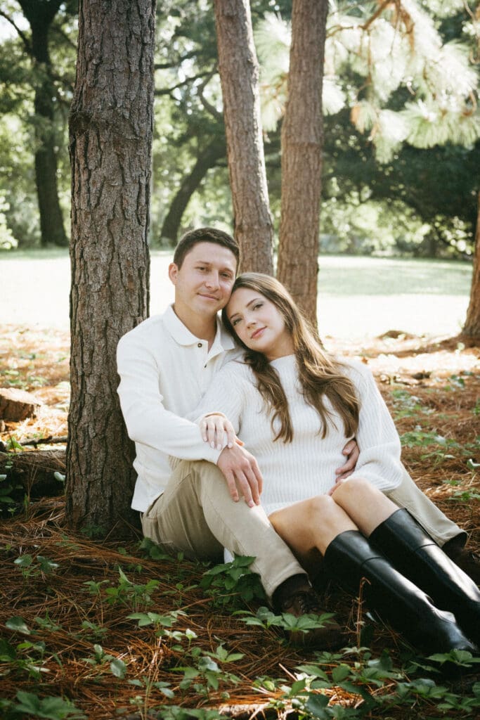 engagement shoot documentary style candid of couple outside under tree hampton park engagement photoshoot