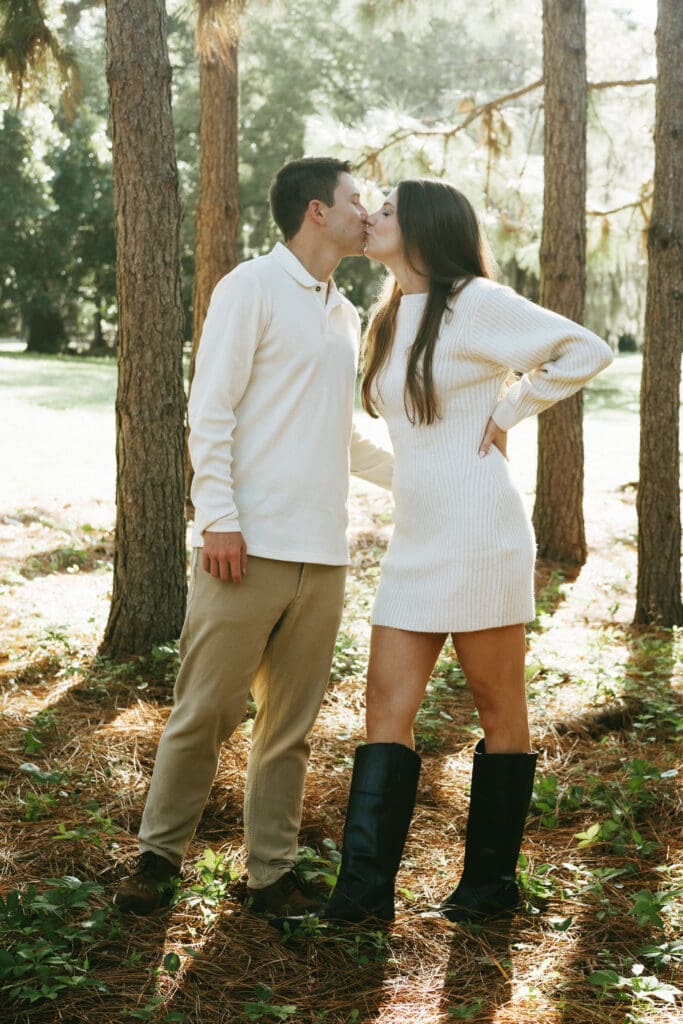 engagement shoot documentary style candid of couple outside under tree hampton park engagement photoshoot