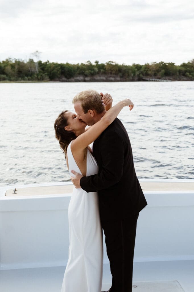 bride and groom editorial style portraits on boat shem creek charleston south carolina