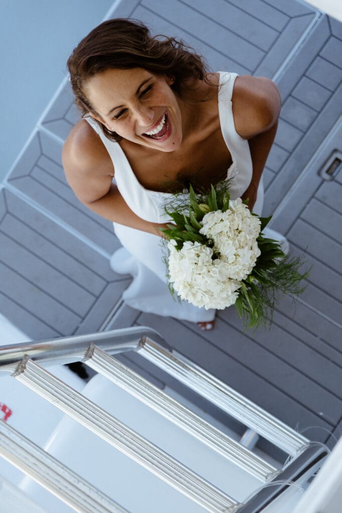 cute bride candid portrait smiling on boat