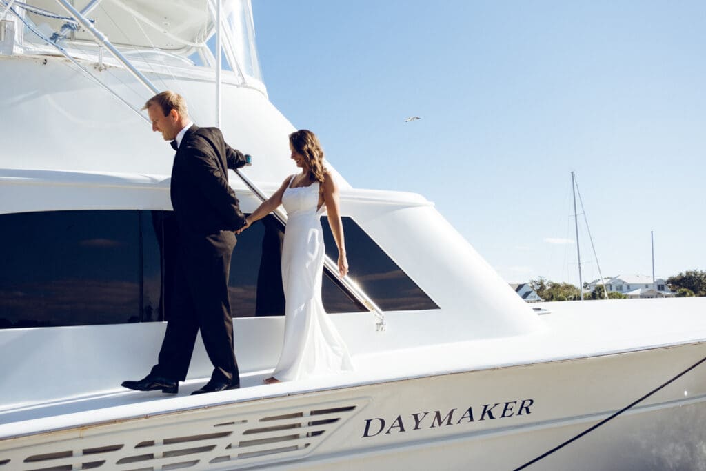 bride and groom editorial style portraits on boat shem creek charleston south carolina