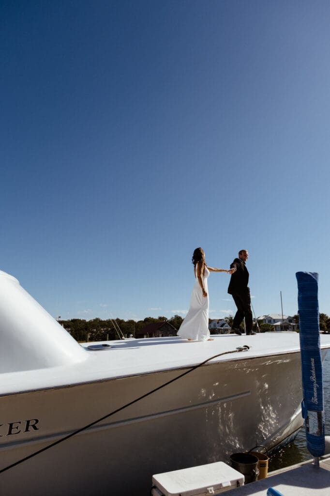 bride and groom editorial style portraits on boat shem creek charleston south carolina