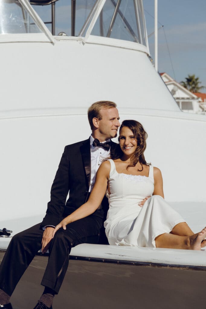 bride and groom editorial style portraits on boat shem creek charleston south carolina