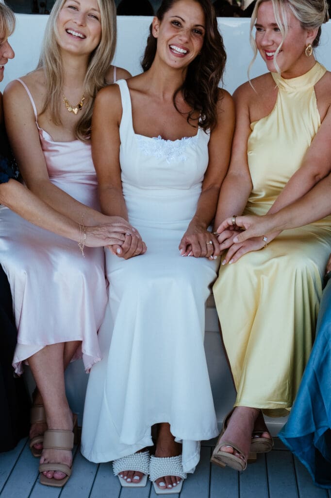 charleston documentary wedding photographer candid bride with bridesmaids on boat