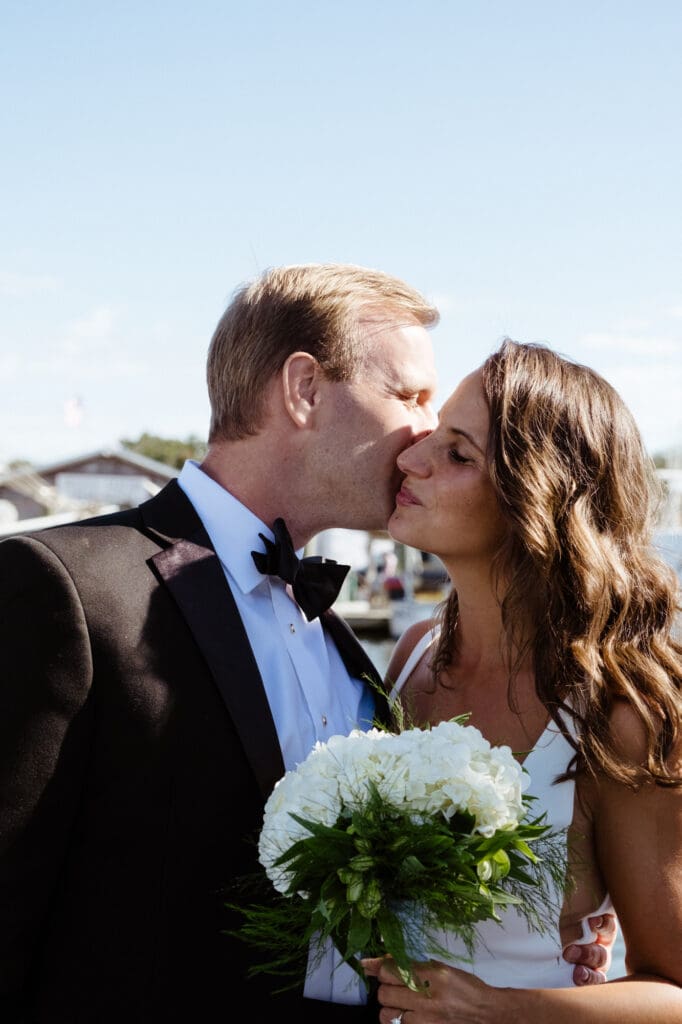 charleston documentary wedding photographer candid couple on boat with couple hugging after first look