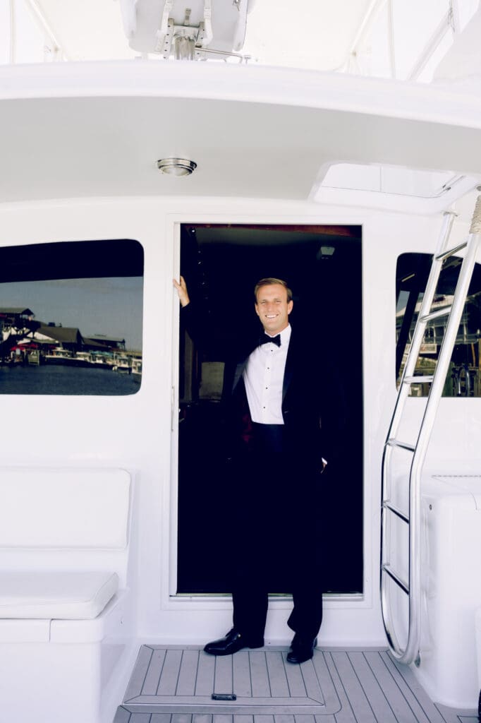 charleston documentary wedding photographer candid groom portrait on boat