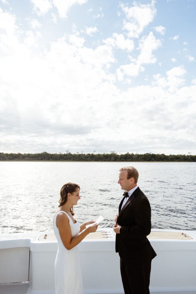 bride and groom editorial style portraits on boat shem creek charleston south carolina