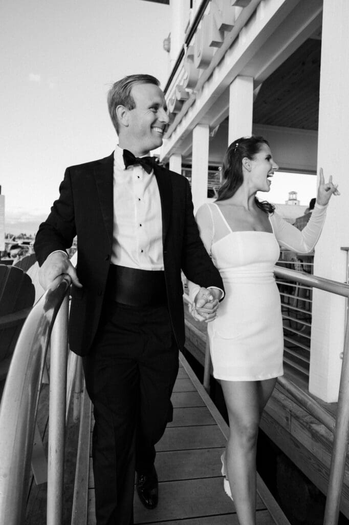 charleston documentary wedding photographer candid couple on boat with sunset black and white