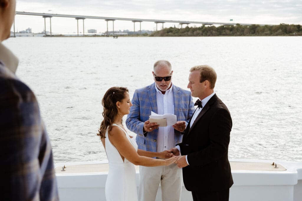 bride and groom editorial style portraits on boat shem creek charleston south carolina