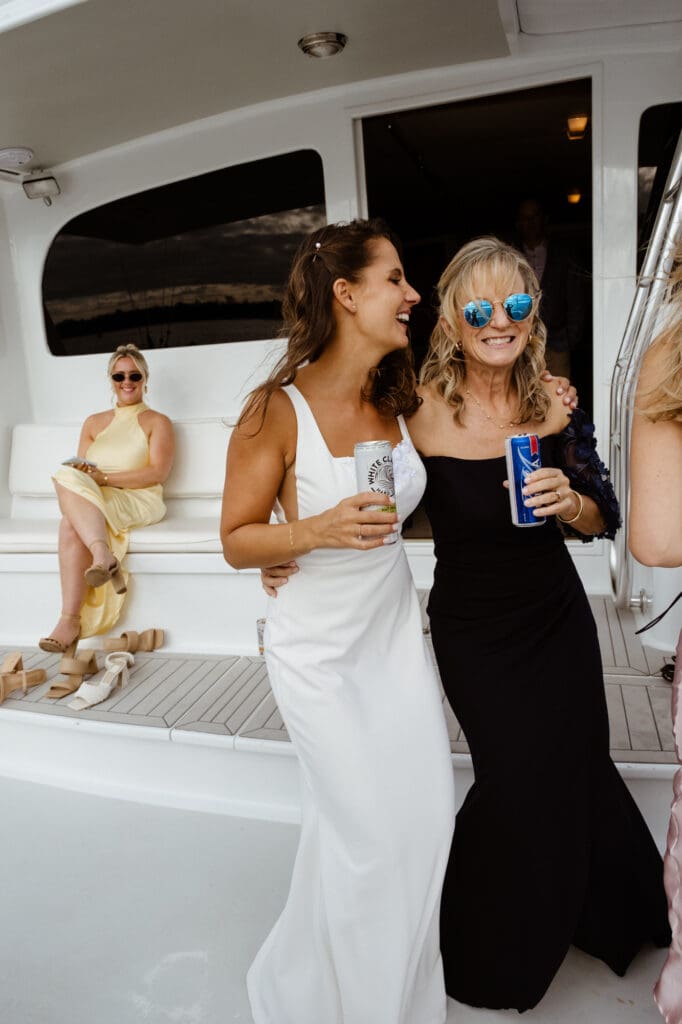 candid wedding day photo of bride with mom