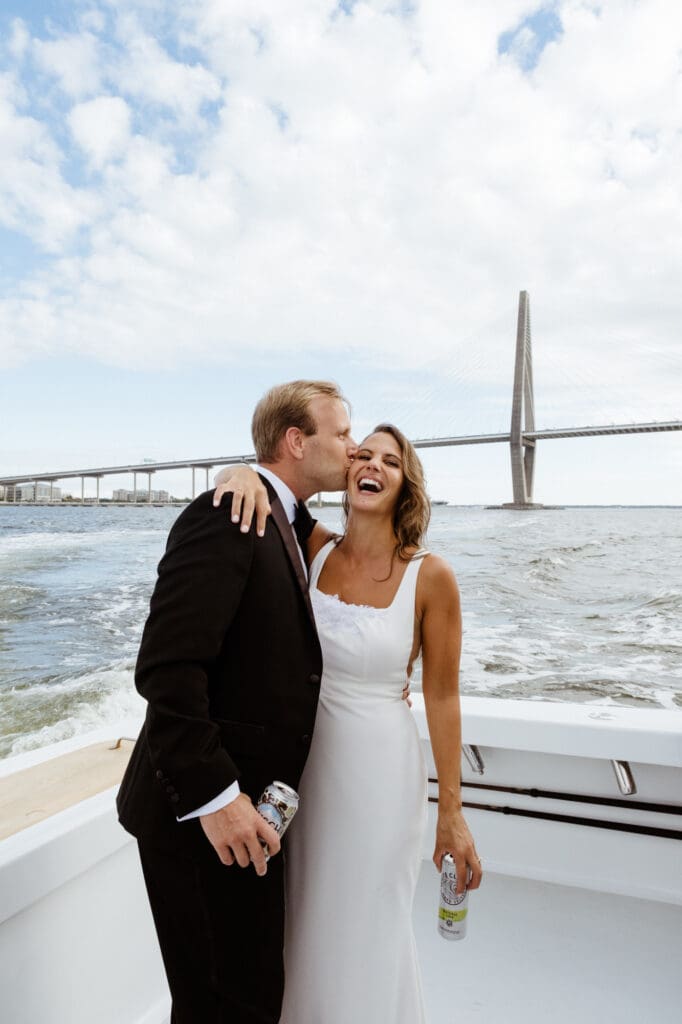 bride and groom editorial style portraits on boat shem creek charleston south carolina with mount pleasant bride in background