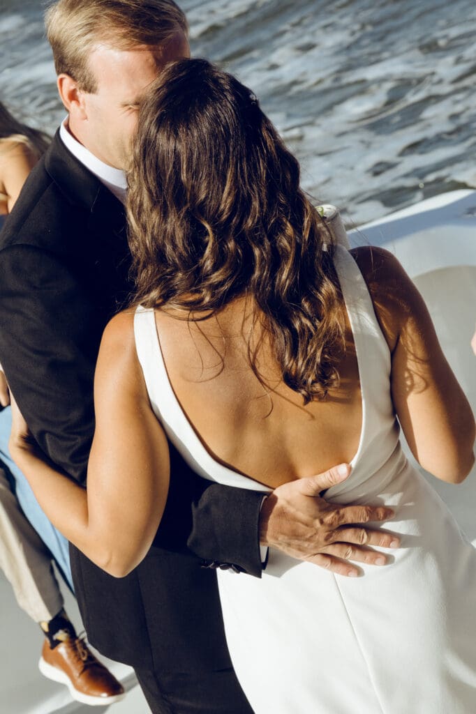 bride and groom editorial style portraits on boat shem creek charleston south carolina