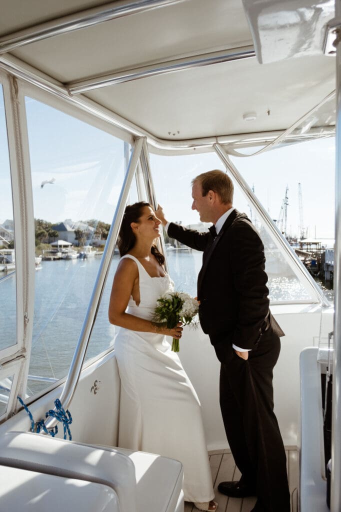 bride and groom editorial style portraits on boat shem creek charleston south carolina