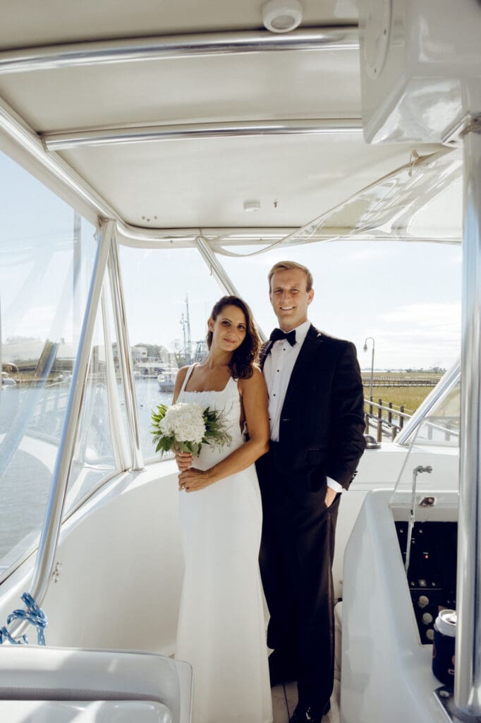 bride and groom editorial style portraits on boat shem creek charleston south carolina