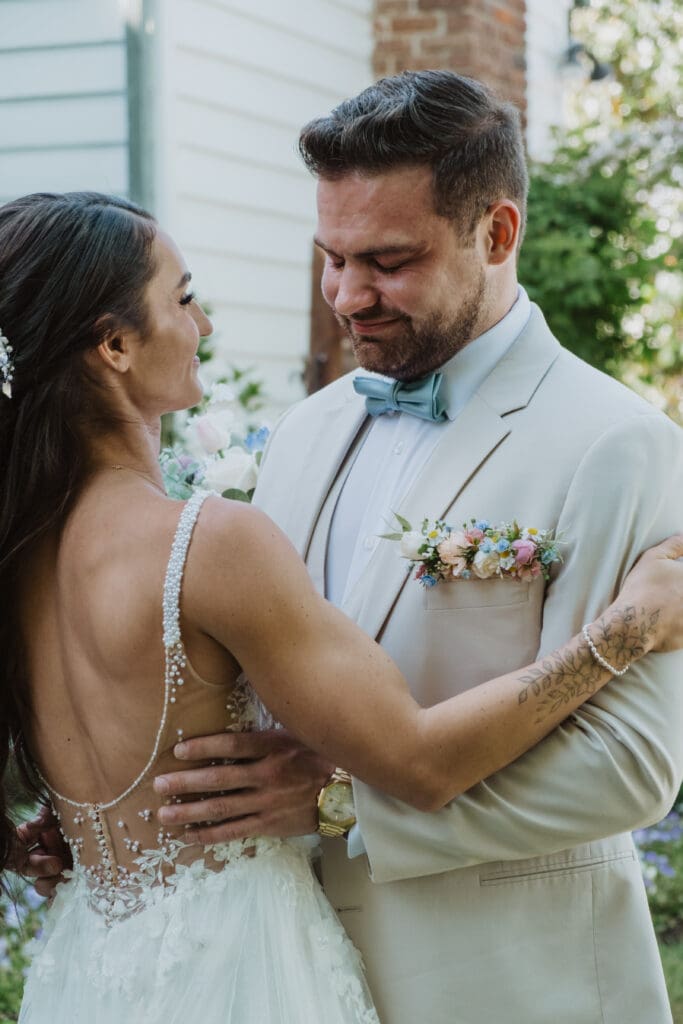 emotional groom crying at first look with bride at boone hall plantation