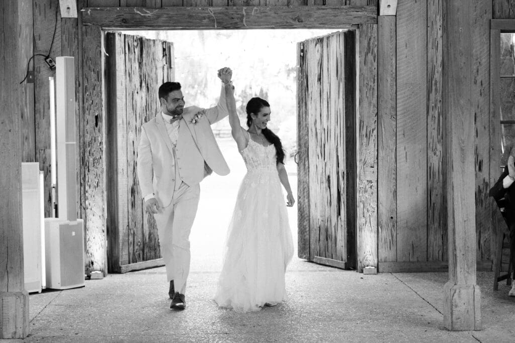 Couple first dance on weathered wood floor of Cotton Dock at Boone Hall, Charleston wedding venue