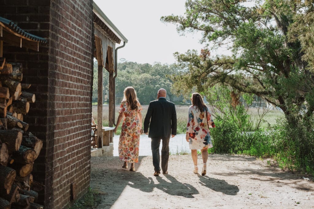 candid guest walking to cotton dock at boone hall plantation for ceremony 