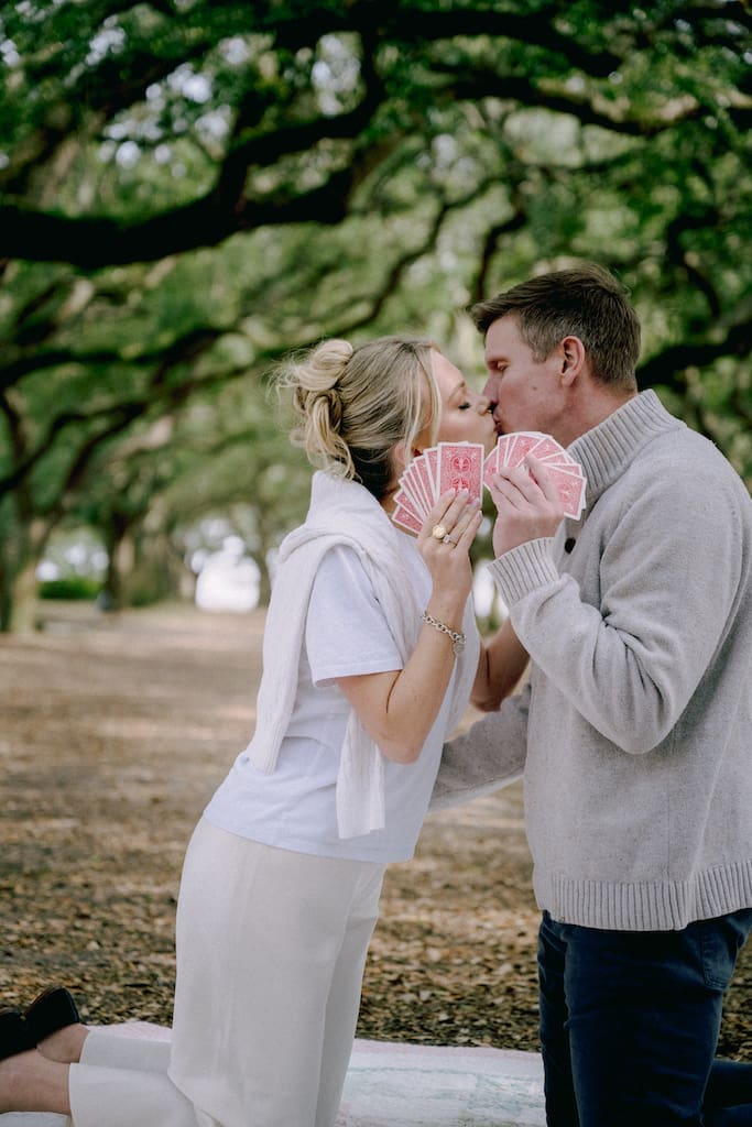 engagement shoot couple playing cards at battery park