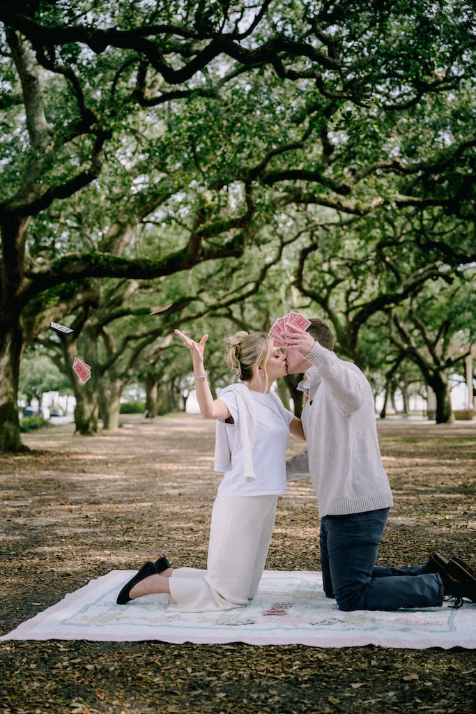 couple in white point gardens engagement photos under trees at battery