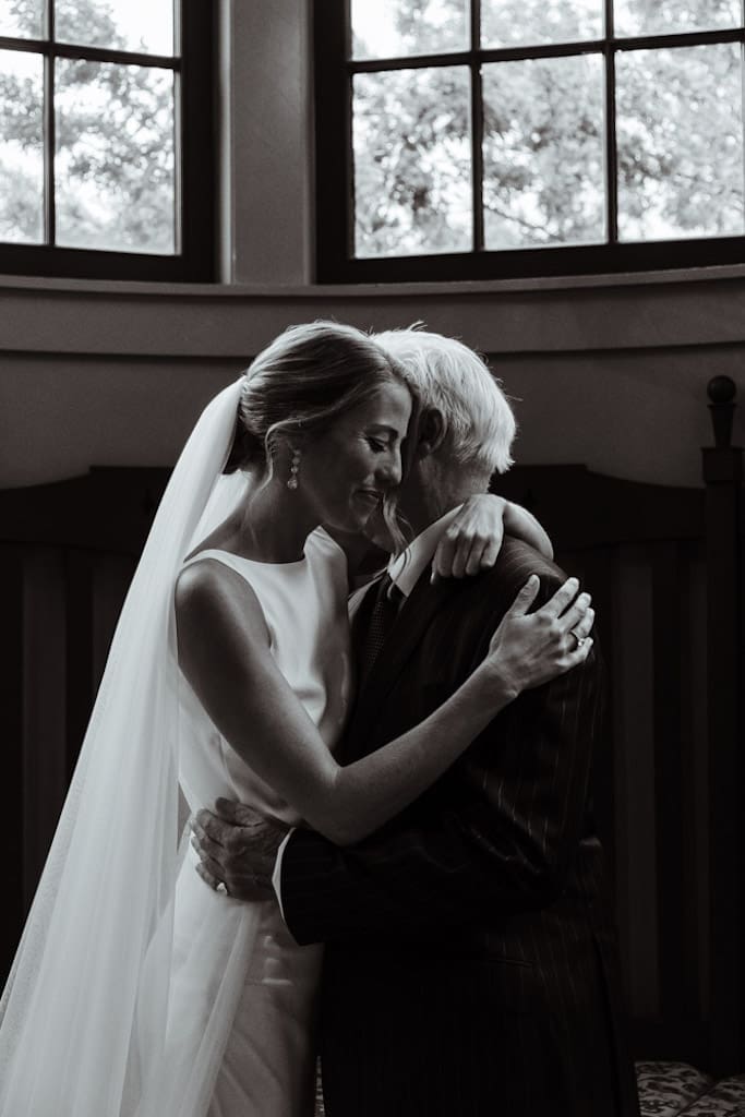 first look photo with bride and dad in black and white inspo