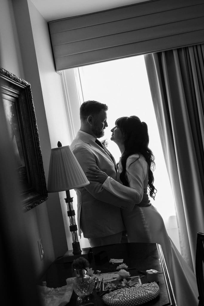 couples portrait in black and white getting ready together