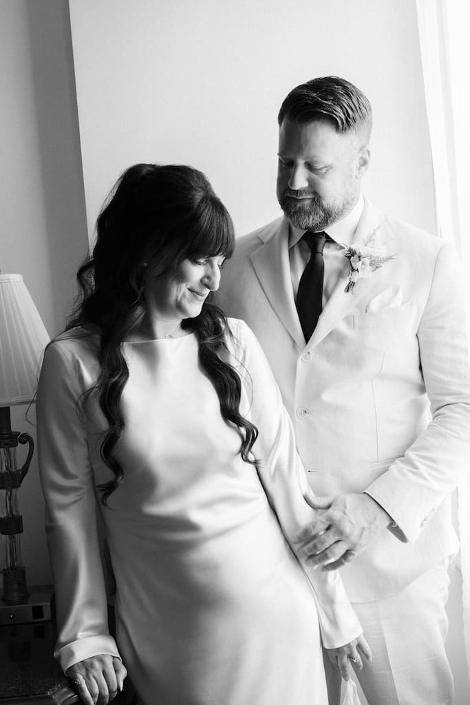 couples portrait in black and white getting ready together