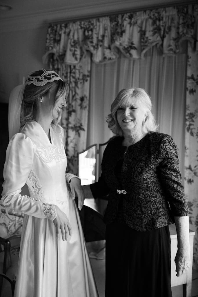 candid bride and mom photo in black and white